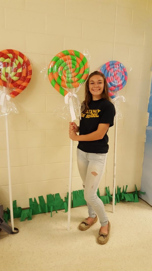 Senior Caitlyn Erdman shows off her 'lollipops' she created out of pool noodles, duct tape, and pvc pipe.