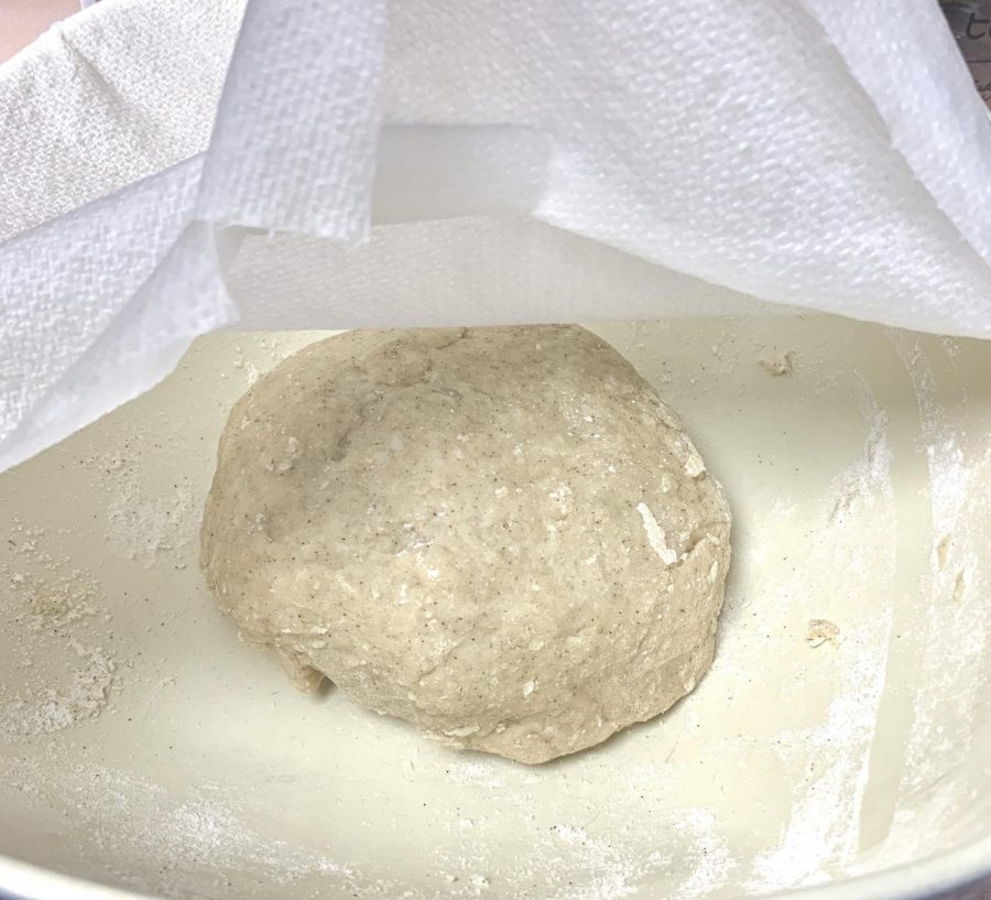Cover the dough loosely with a damp towel and let it rest for about 15 minutes.