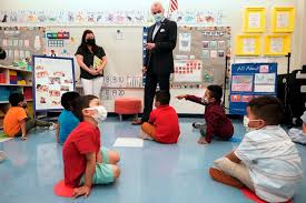 Governor Murphy is in the middle, a teacher is on the left, and the Pre-K students are in the middle