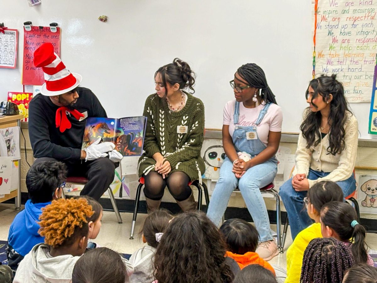 NEHS students read to elementary students for Read Across America Day