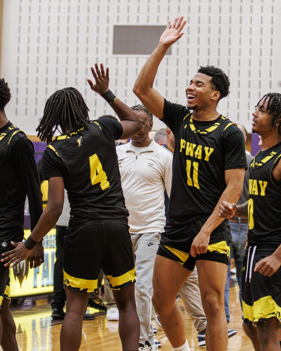 Donald Nwaigwe (#11) celebrating with Elijah Foster (#4) after the win