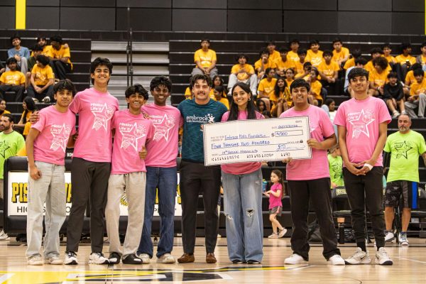FBLA Officers taking a picture with the Embrace Kids Foundation